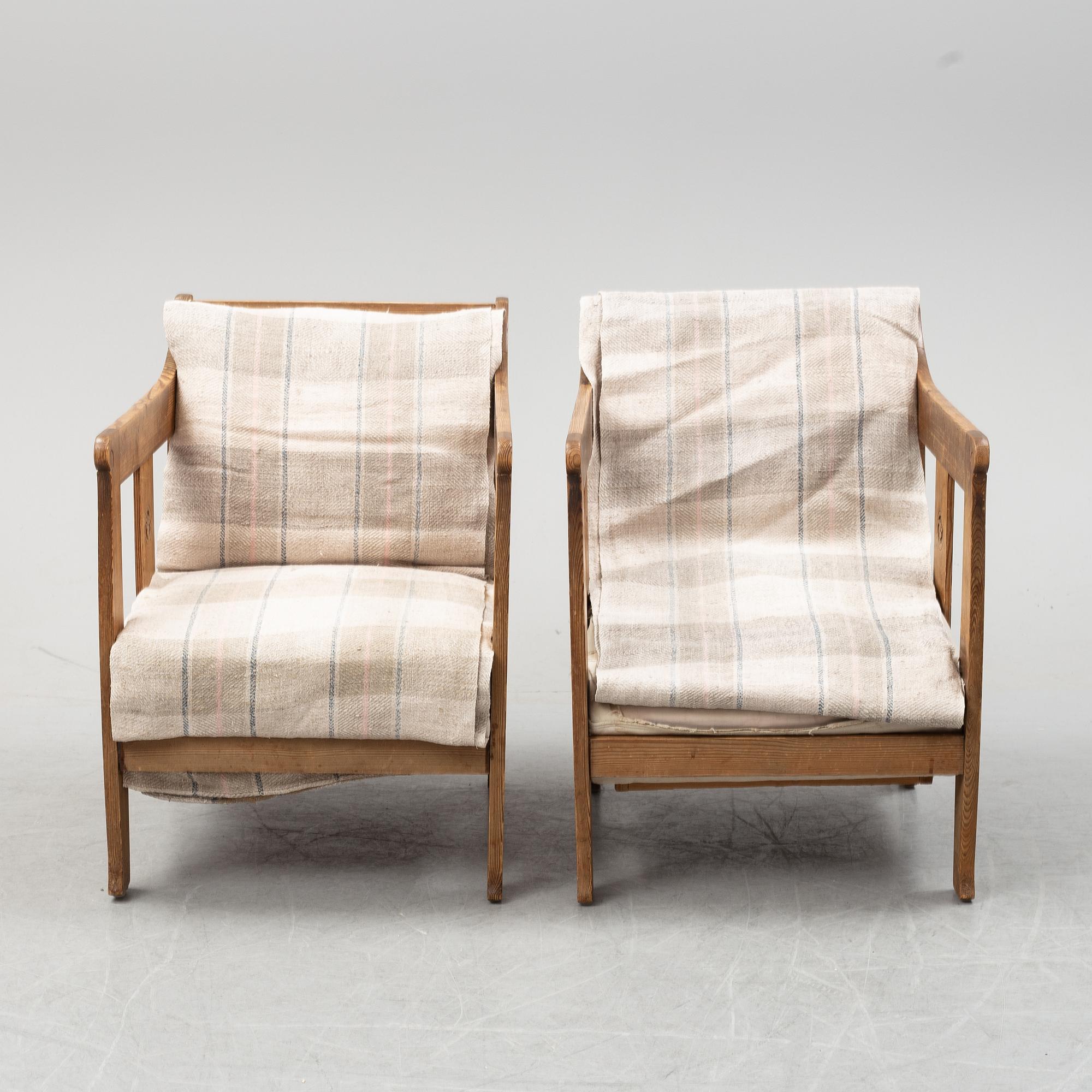 A pair of pine armchairs attributed to Carl Westman, early 20th Century.