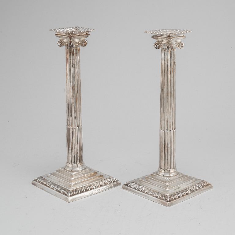 A pair of English 18th century silver candlesticks, worn marks, London.