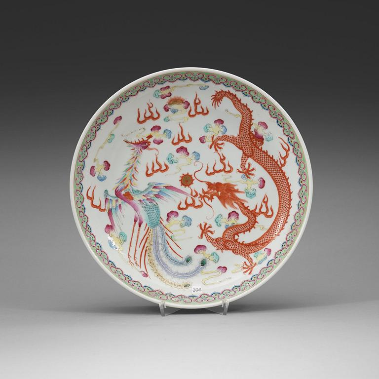 A phoenix and dragon famille rose dish, Qing dynasty, with Guangxu six character mark and period (1875-1908).