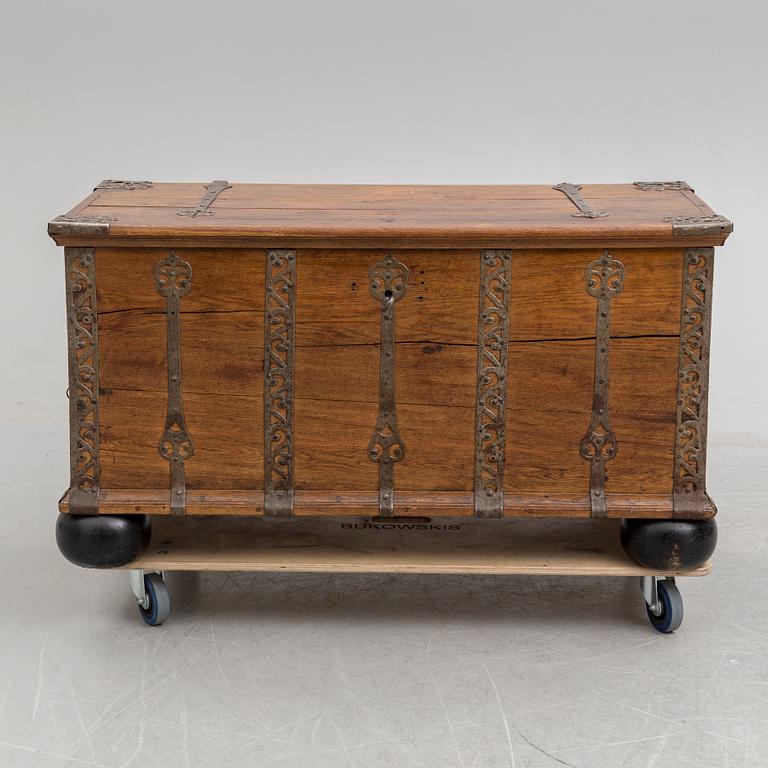 A 18th century baroque oak chest with iron mountings.