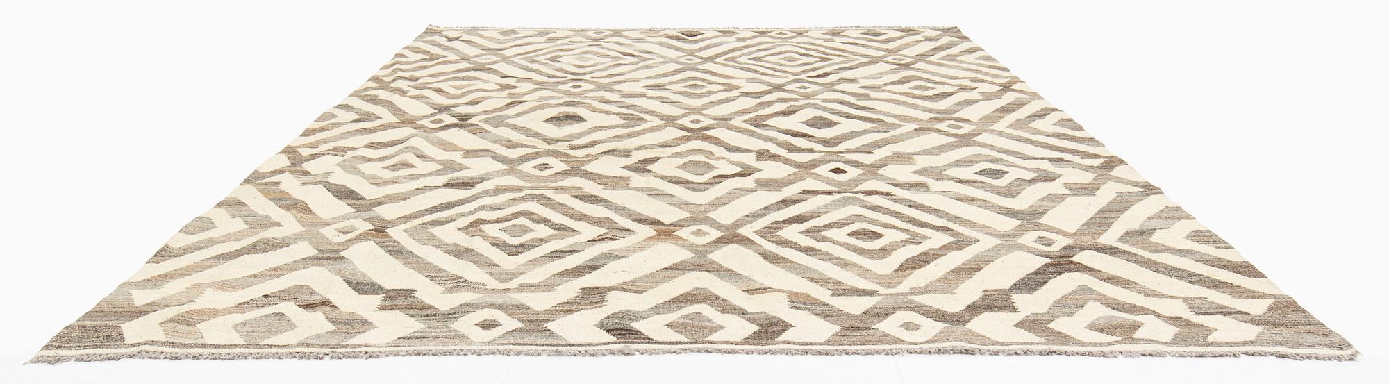 A Kilim carpet, c. 290 x 250 cm.