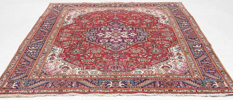 A Tabriz carpet, c. 342 x 245 cm.