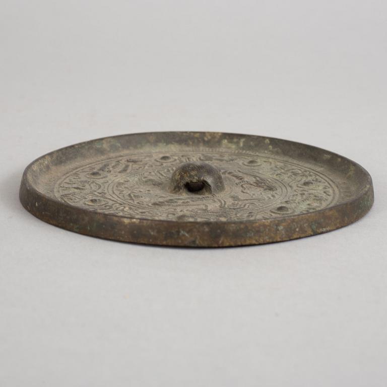 SPEGEL, brons. Handynastin (206 f. Kr. -220 e. Kr.).