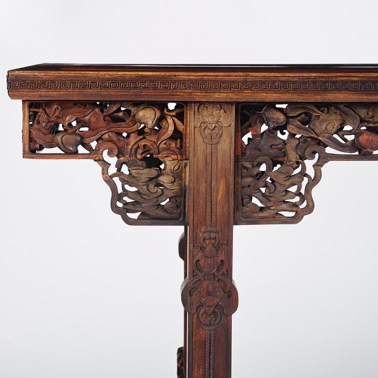 A massive zitan recessed-leg long table 'Jiaotousun Qiotouan', Qing dynasty, 19th century.