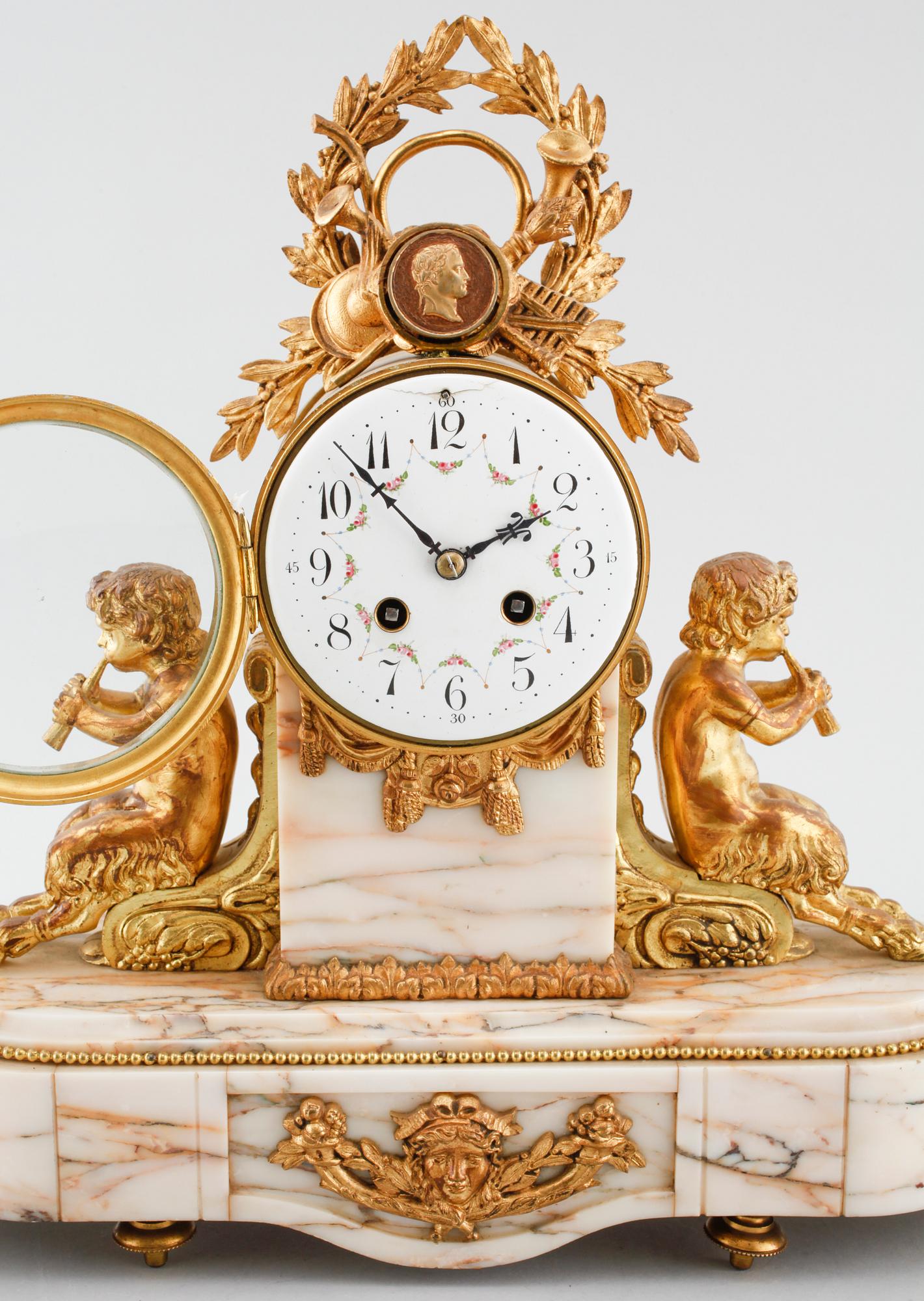 A table clock and two decoratives urn, around year 1900.