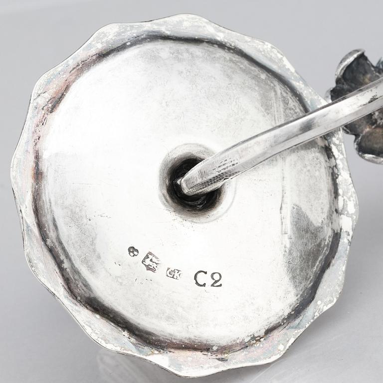 A pair of Swedish 18 century silver candelabras, mark of Lars Åkerblom Gävle 1775, arms by Christian Kullberg.