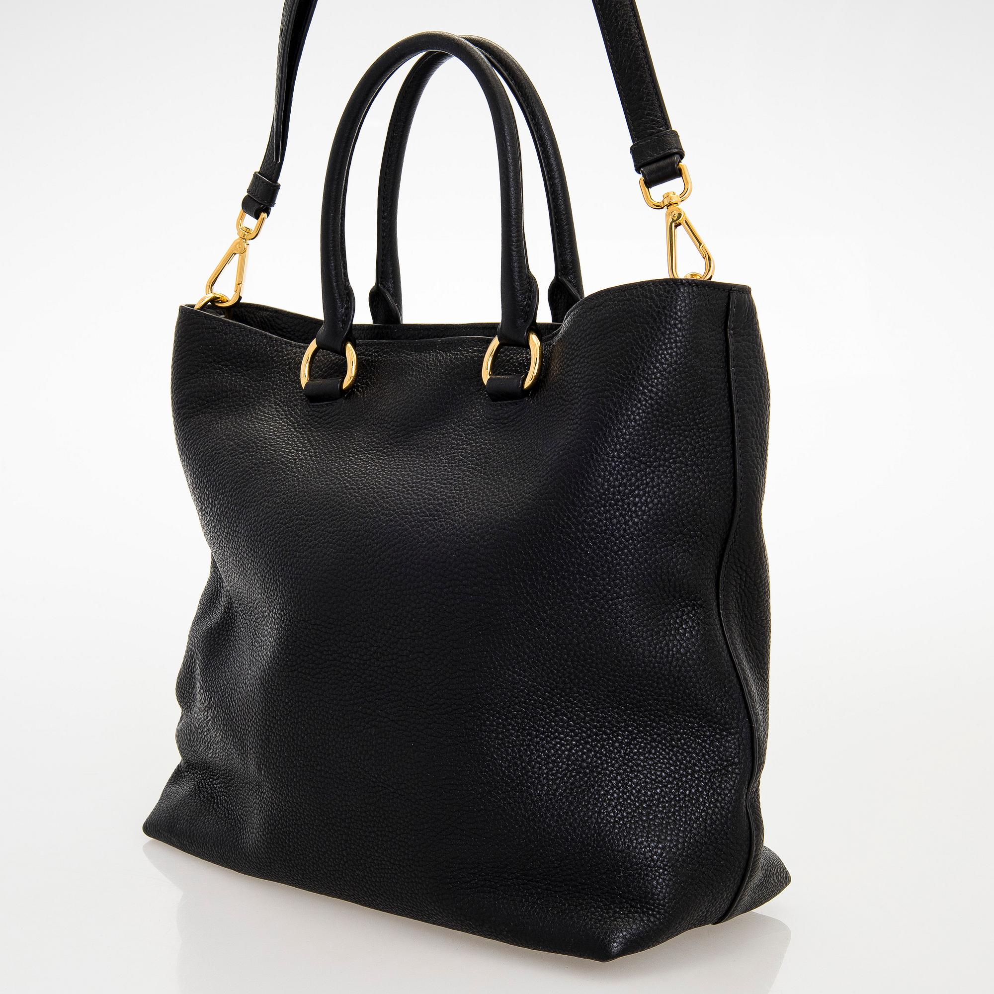 Prada, A 'Vitello Daino Tote' bag.