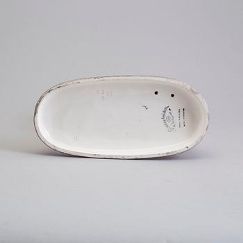 a creamware figurine by Stefan Dakon, Goldscheider, 1938.
