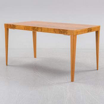 A 1940's dining table an four chairs.