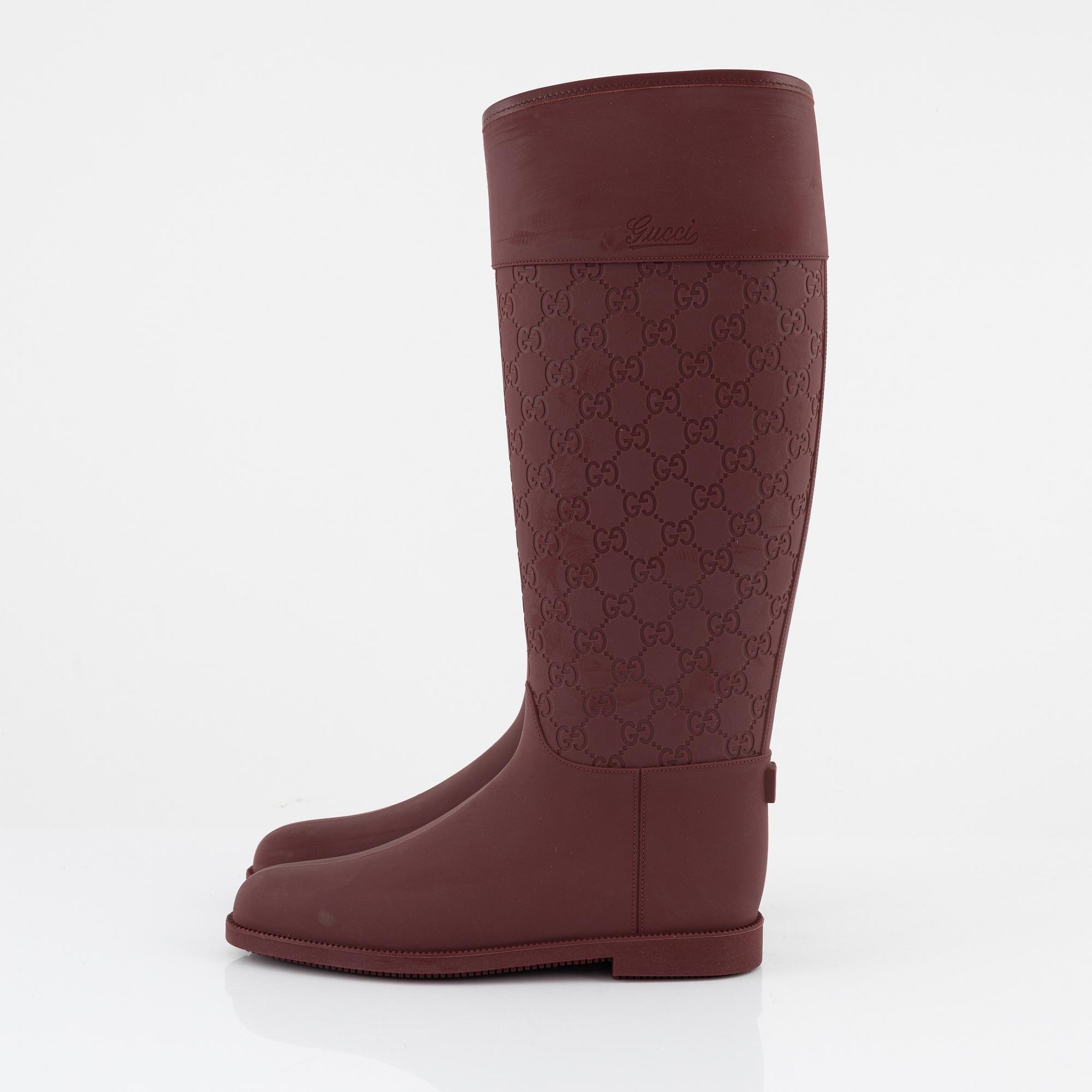 Gucci a pair of burgundy rubber boots Italian size 37. Bukowskis