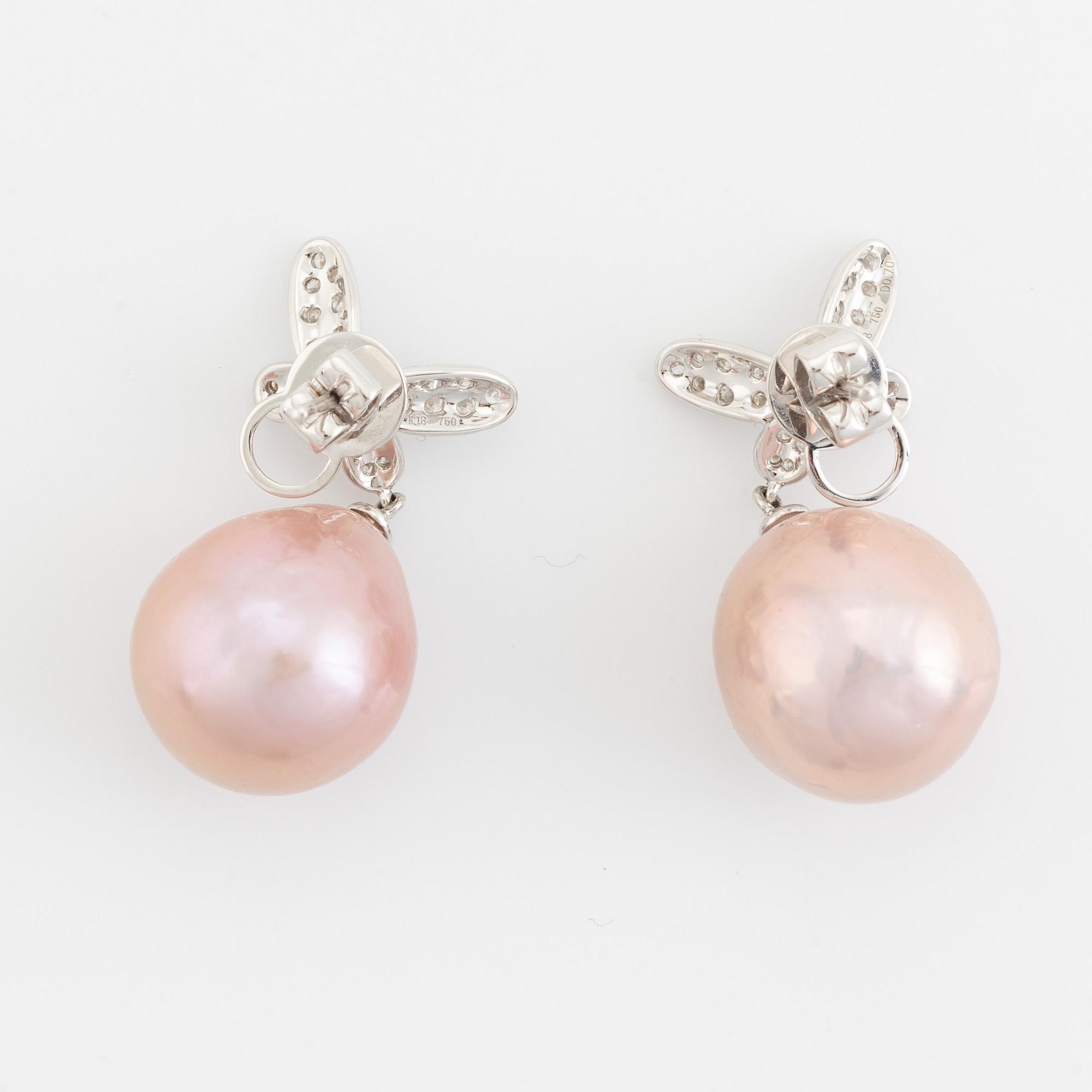 Pink freshwater pearl and brilliant cut diamond butterfly earrings.