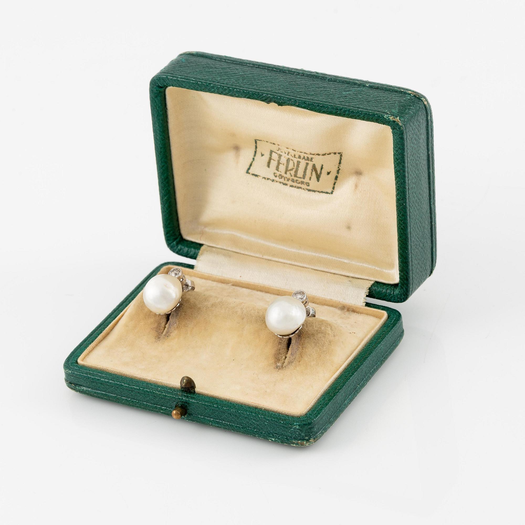 A pair of platinum earrings with bouton pearls and old-cut diamonds.