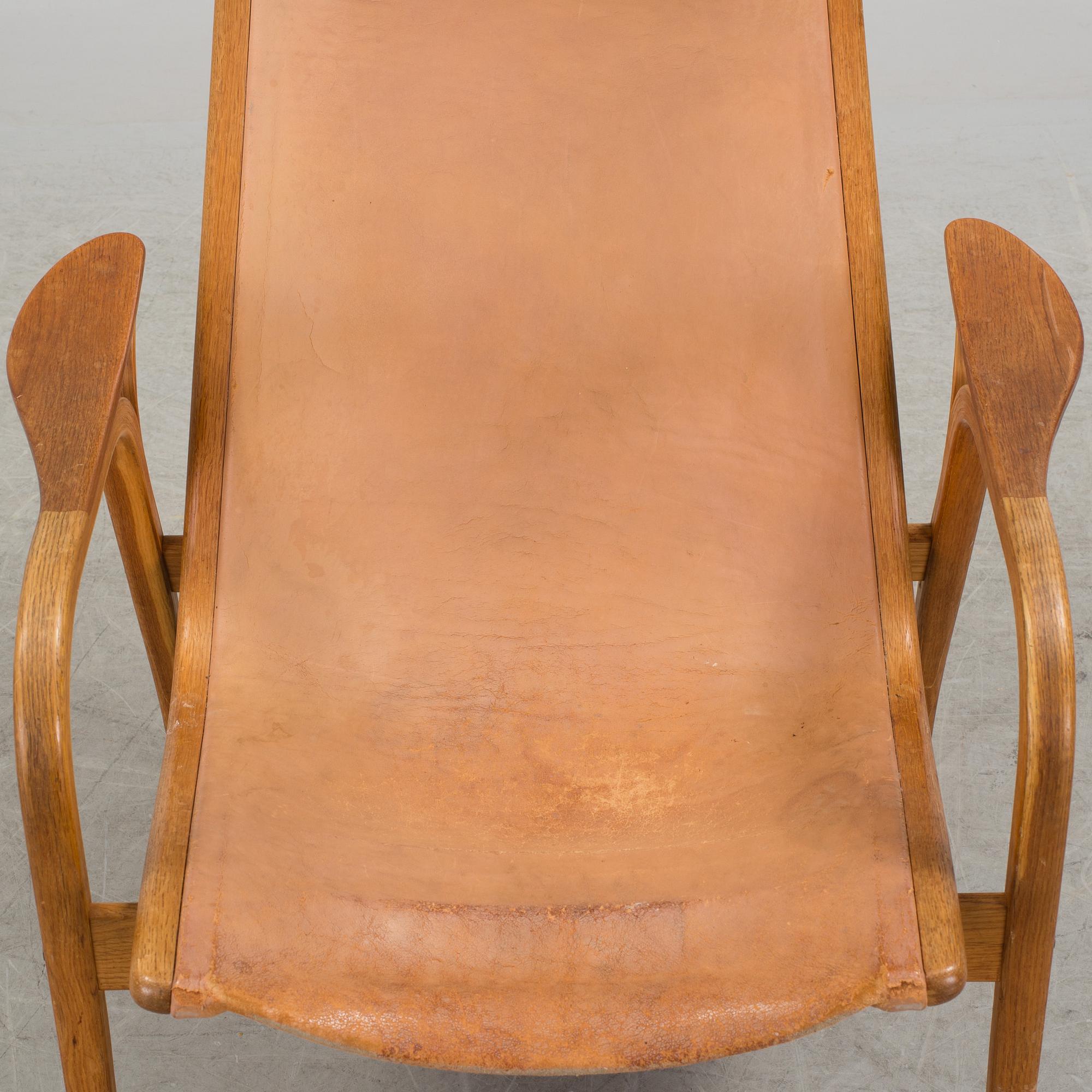 YNGVE EKSTRÖM, a 'Lamino' oak and teak easy chair from Swedese.