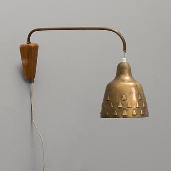 a 1950's brass and teak wall light.