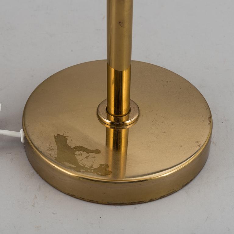 A decond half of the 20th Century brass and glass table light from Bergboms.