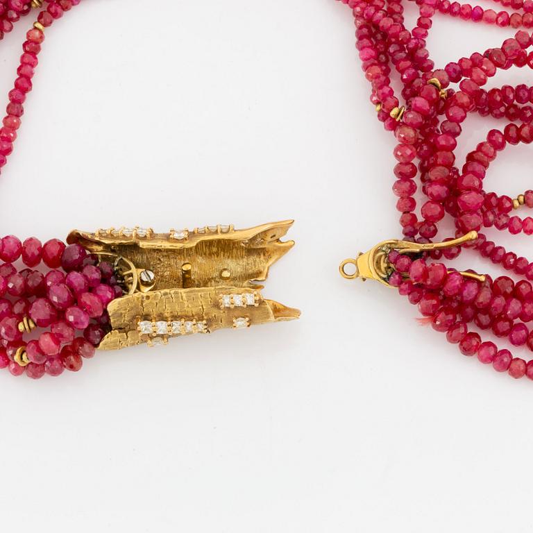 A W Nussberger ruby necklace with an 18K gold clasp set with princess-cut diamonds.