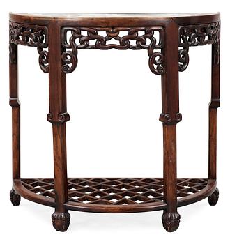 1679. A hardwood and marble 'claw on ball' D-form console table, presumably late Qing dynasty.
