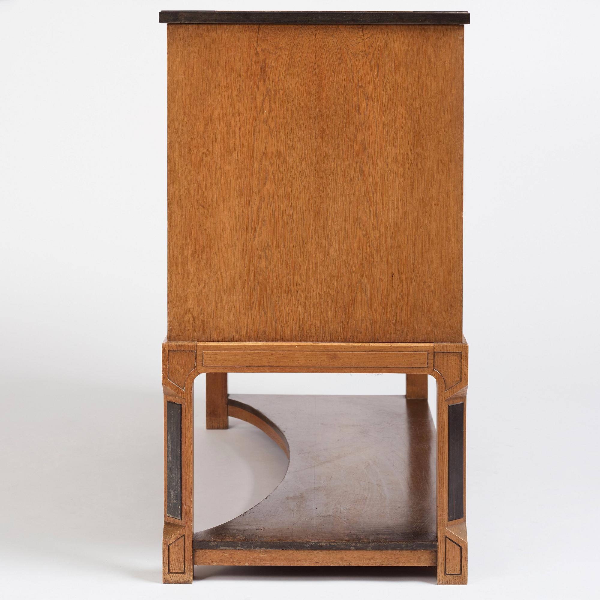 Carl Bergsten, an oak veneered sideboard/ chest of drawers, Nordiska Kompaniet Sweden 1923. Part of a set exhibited in Gothenburg 1923.