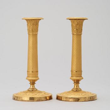 A pair of French Empire 19th century candlesticks.