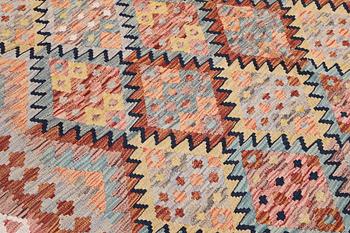 A Kilim rug, c. 249 x 169 cm.