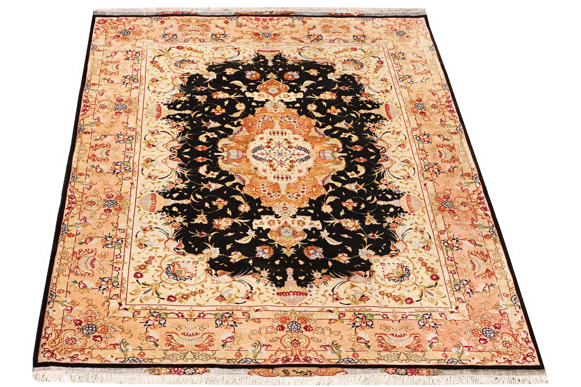 A Tabriz rug, a. 210 x 147 cm.