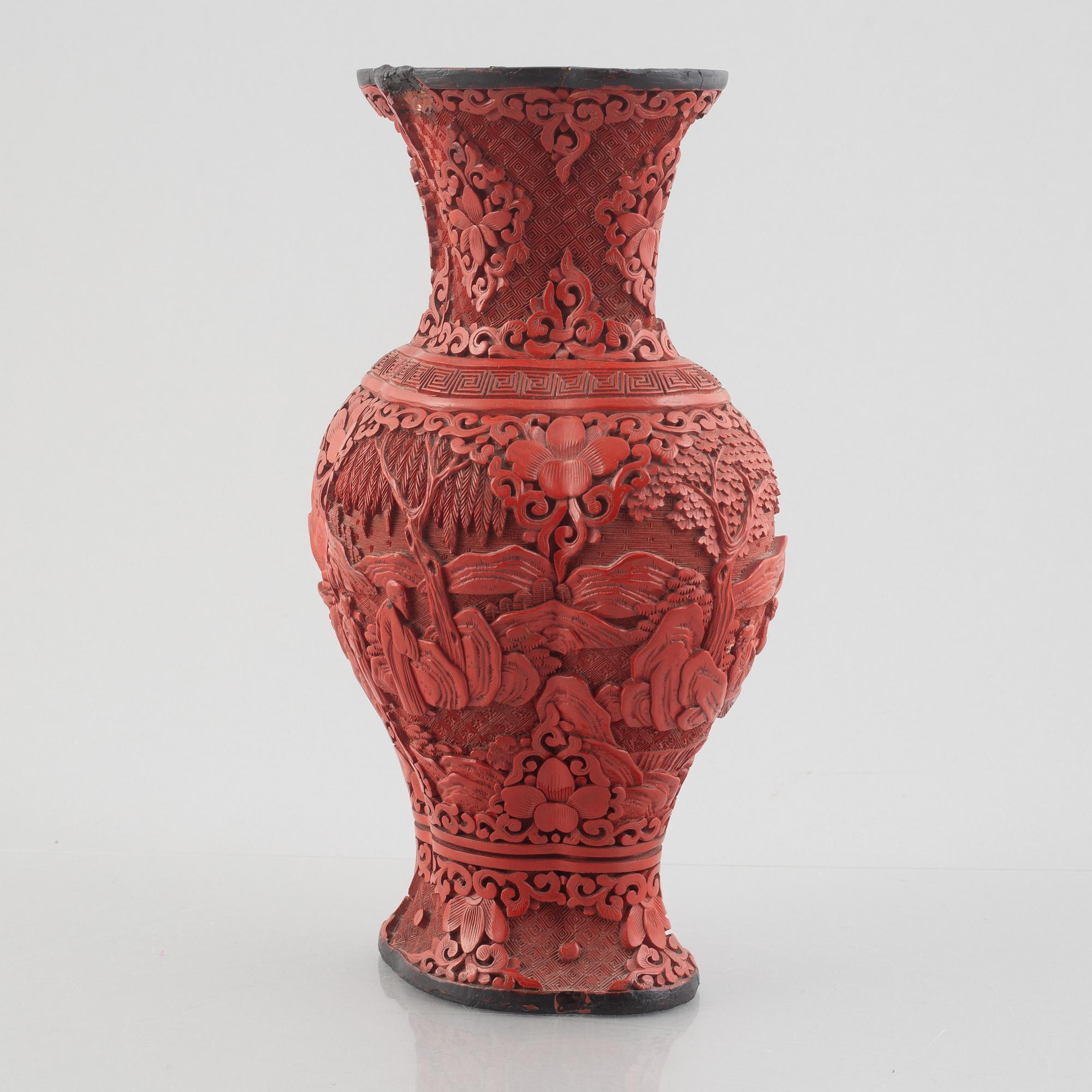 A red laquer vase, early 20th century.