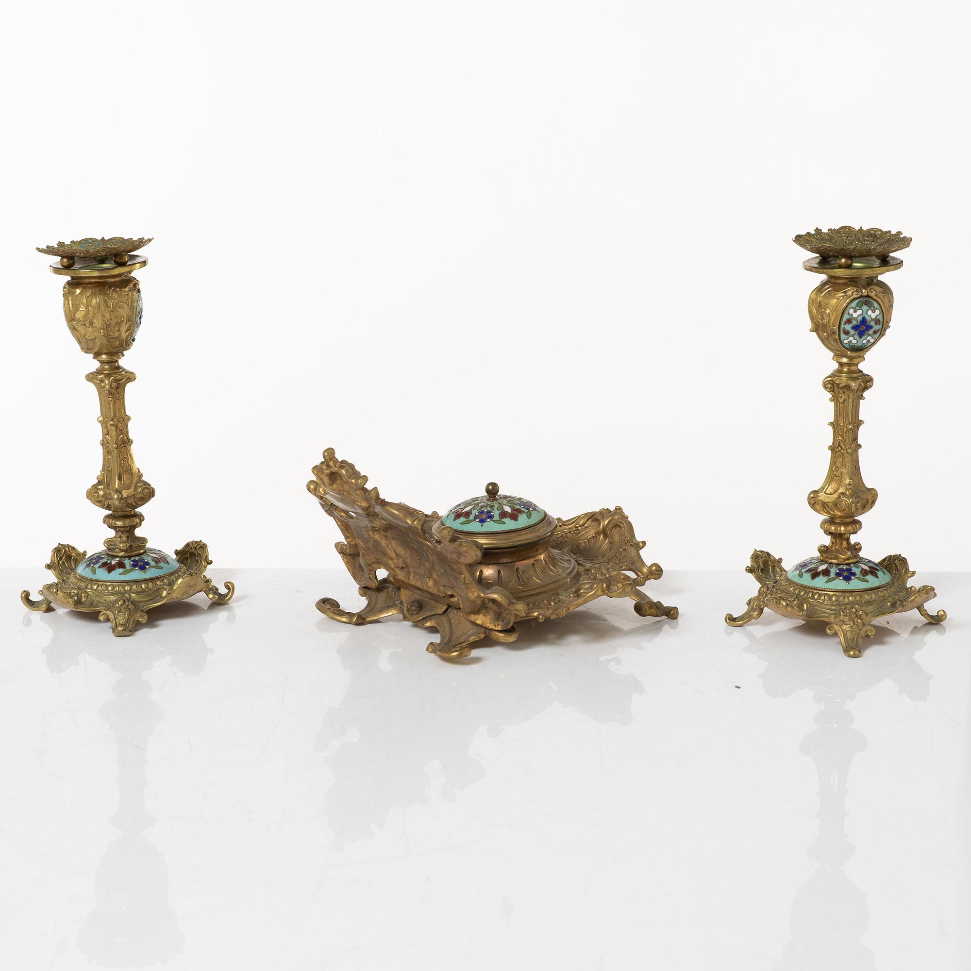 A pair candlesticks and an inkwell, circa 1900.