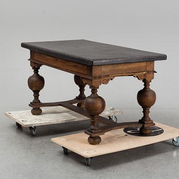 A 19th Century Baroque style table with a stone top.