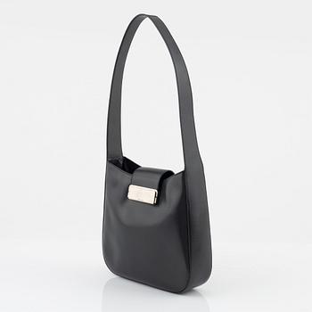 Prada, a dark grey leather bag.