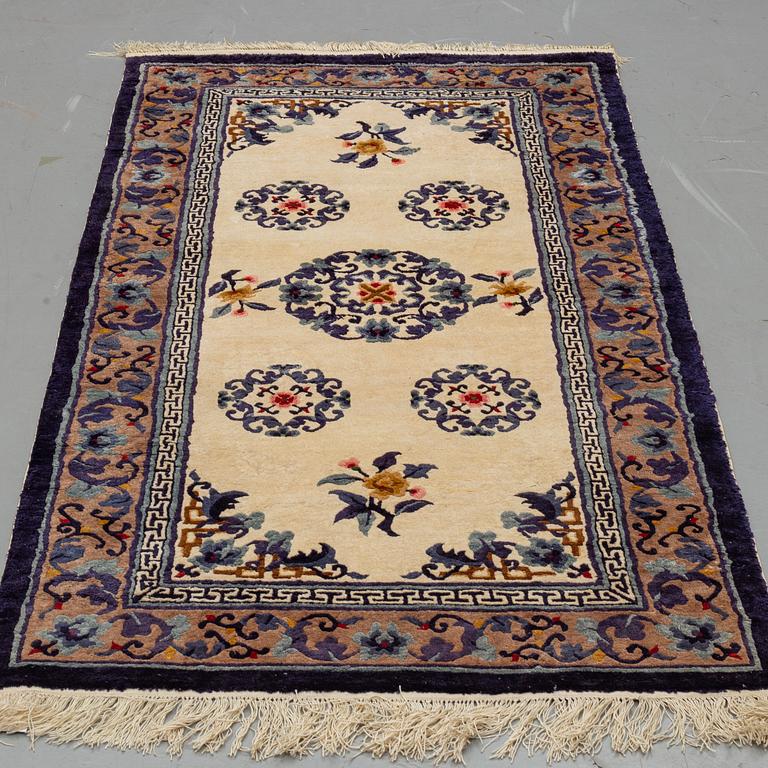 A CARPET, Old silk China, ca 187 x 95 cm.