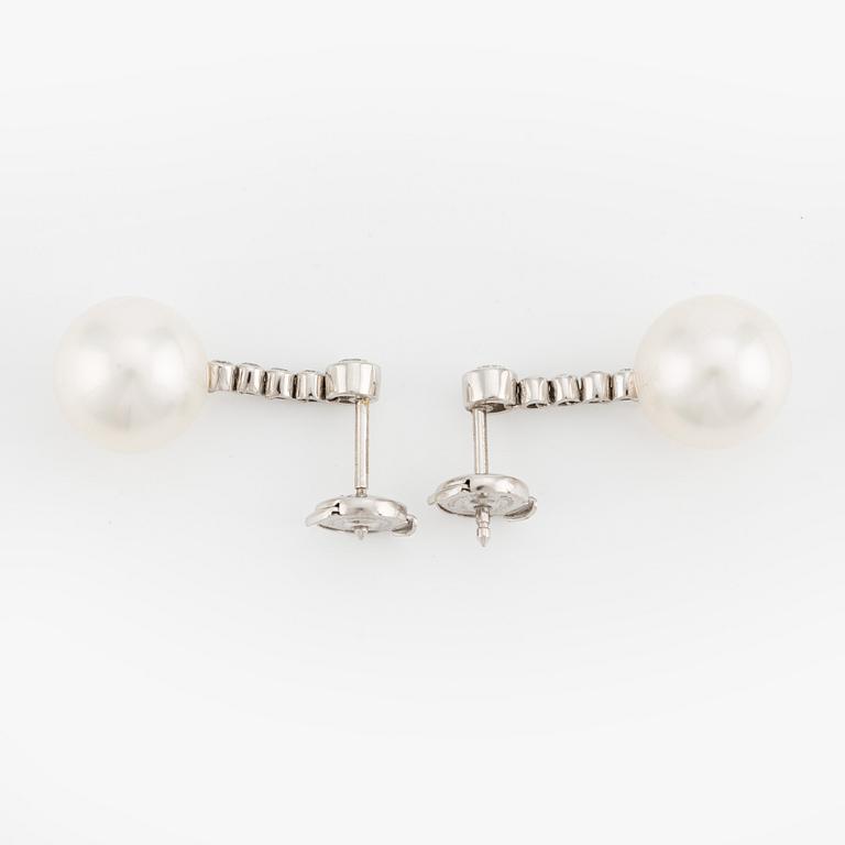 A pair of Tiffany & Co  platinum earrings with cultured pearls and round brilliant-cut diamonds.