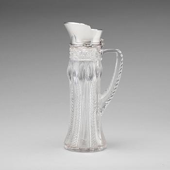 178. A Tiffany & Co silver and cut glass decanter, circa 1900.