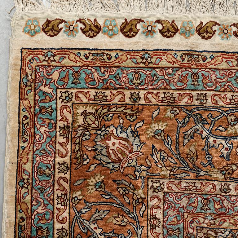 A carpet, an old silk Turkey, ca 237,5 x 146,5  cm (as well as 3,5-4 cm flat weave at the ends).