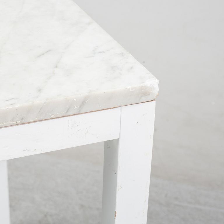 A marble top table, 21th century.