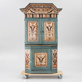 A Dalecarlian polychrome painted cabinet, dated 1798.