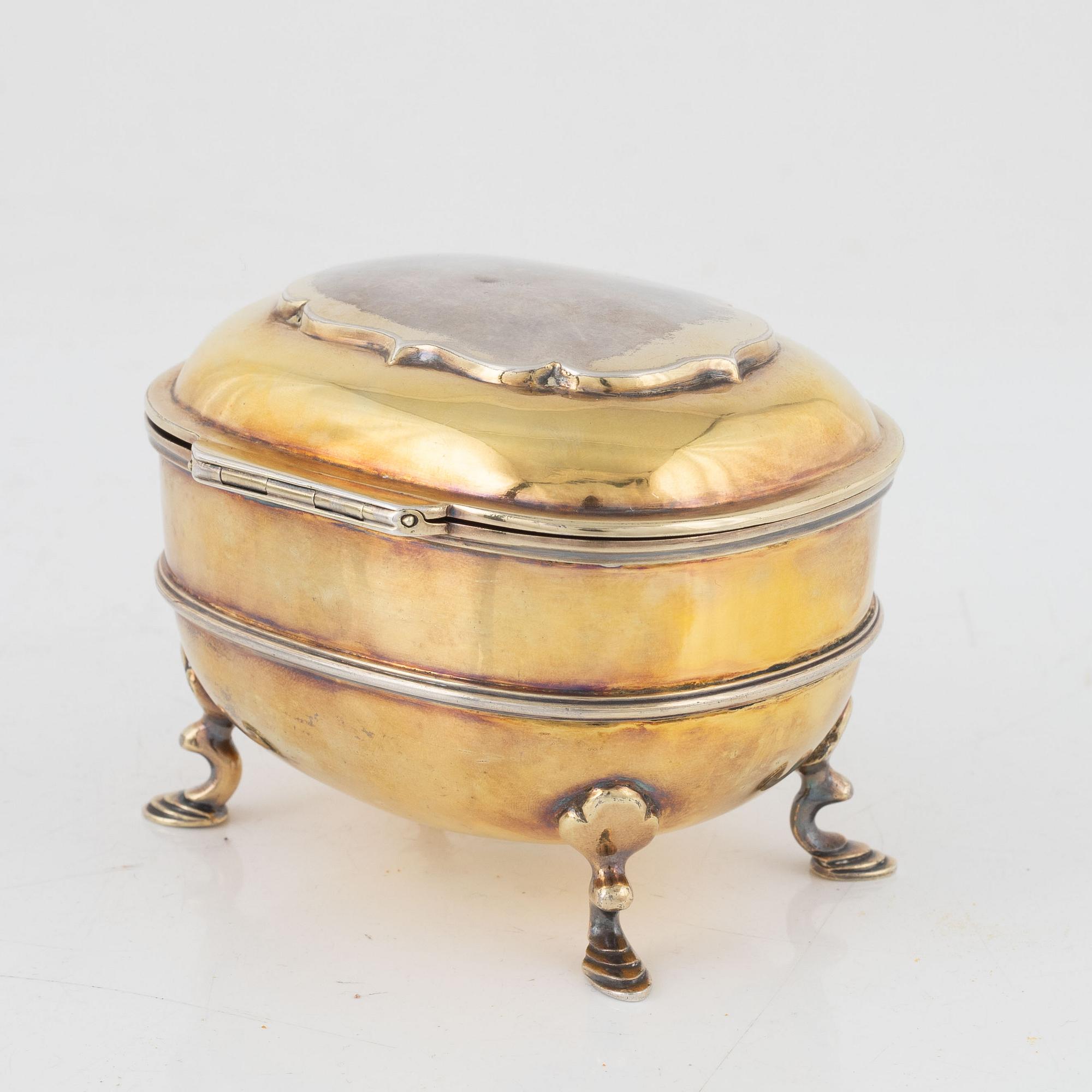 A parcel-gilt silver sugar box, Carrington & Co, London, England, 1894.