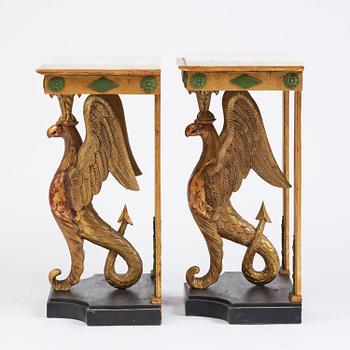 A pair of giltwood console tables, Empire-style incorporating older elements.