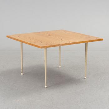 A coffee table marked Tapio Wirkkala, Asko, Made in Finland.