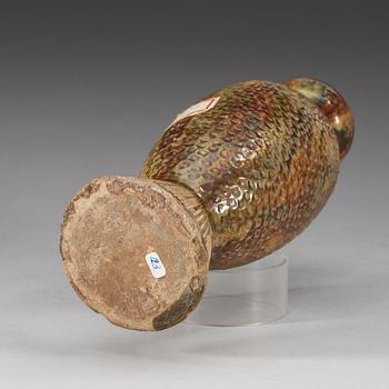 A potted fish shaped vase, presumably Tang dynasty.