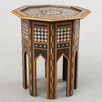 A mother of pearl and wood small table, 20th century.