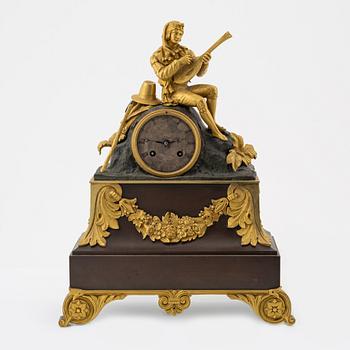 An ormolu and patinated bronze mantel clock, mid 19th Century.