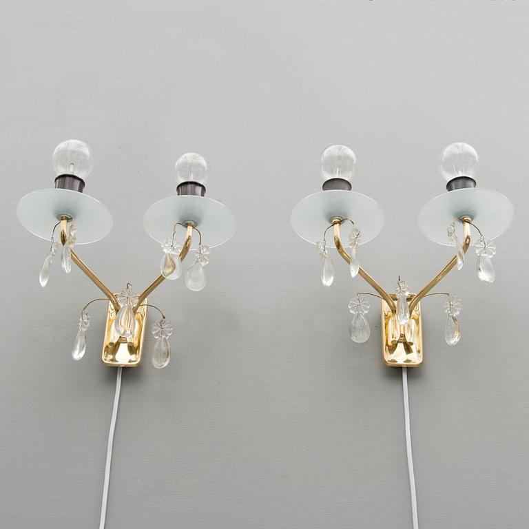 A pair of early 1950s '9413' wall lights for Taito, Finland.