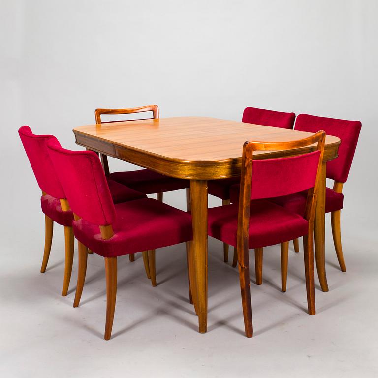 A mid 20th century dining table and a set of four chairs, Oy Boman Ab and two chairs Werner West.