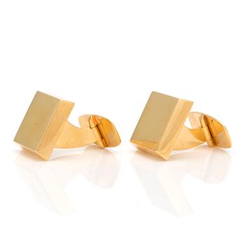 A pair of 18K gold cuff-links.