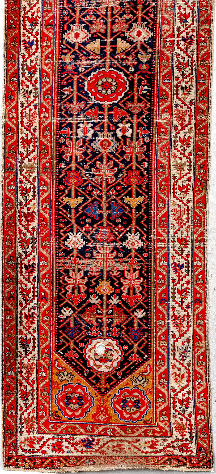 An antique Malajir runner ca 505x102 cm.