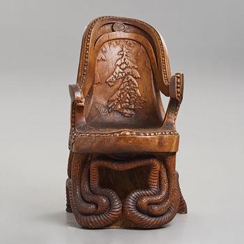 Knut Fjaestad, an Art Nouveau sculptured and carved pine throne, Sweden early 20th century.