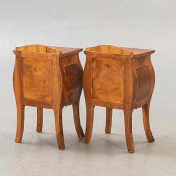 A pair of Baroque style mahogany bedside tables first half of the 20th century.