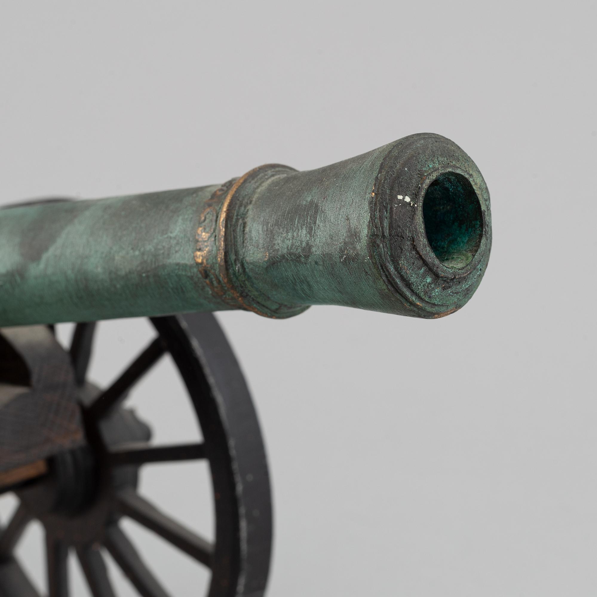 A copy of a field canon with monogram of king  Karl XII produced by Svensk Metallkonst, Carlscrona in late 20th century.