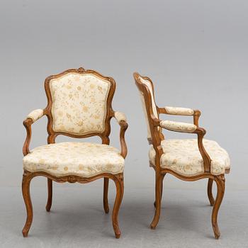 A pair of 18th century armchairs.
