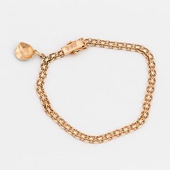 ARMBAND med en BERLOCK, 18K guld.